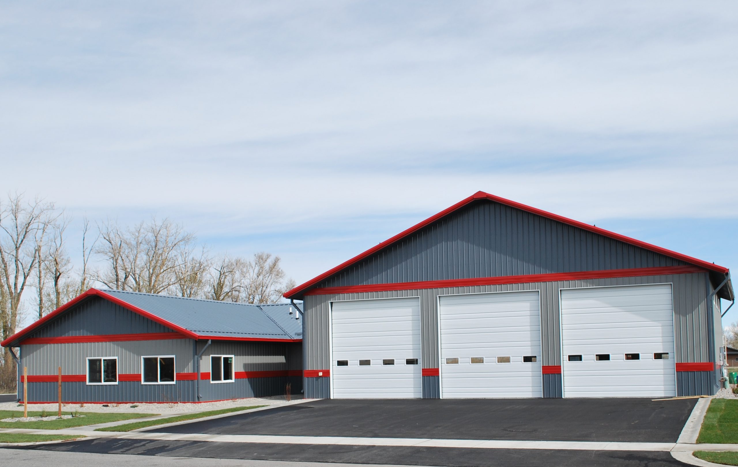 two grey and red metal commercial buildings